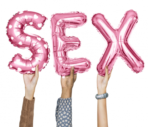 hands holding balloons that say "sex"