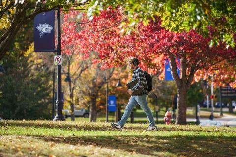 Student walking across campus.