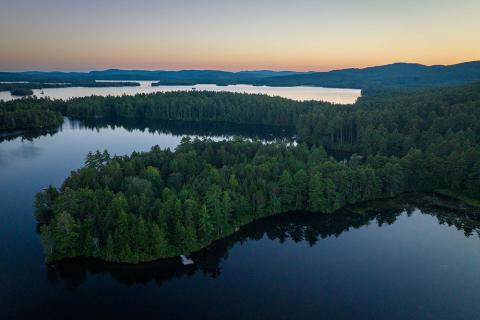 photo of lake with trees in New Hampshire