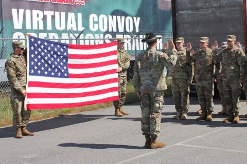 UNH ROTC Students in formation with US Flag