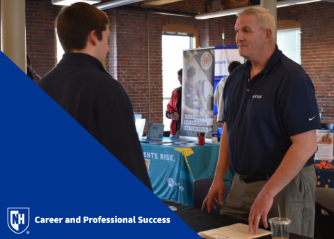 Student interacting with employer at UNH Manchester Career Fair