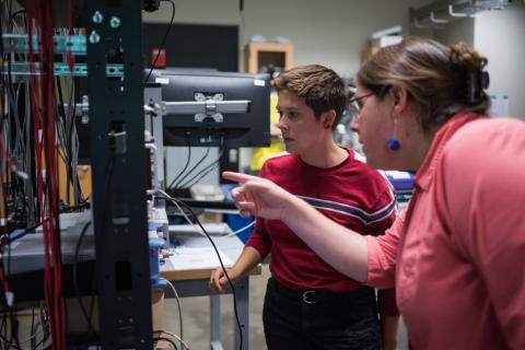 student and professor working in a lab