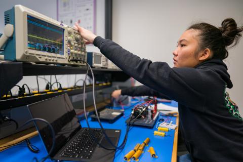 Student works on experiment at UNH