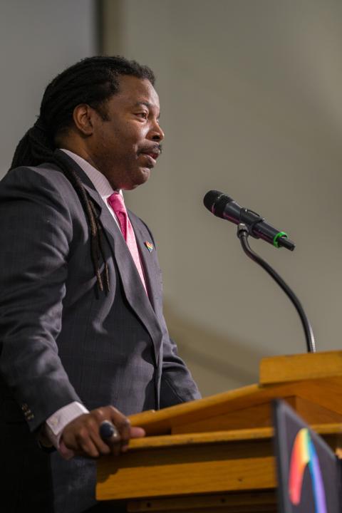 Speaker stands on stage