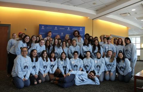 Participants of the Audre Lorde Summit in 2023 dressed in blue sweatshirts