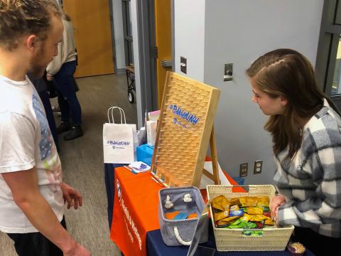 Sexual Well-Being Intern and Student playing plinko