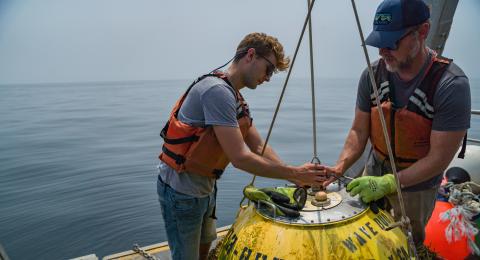 researchers on UNH boat