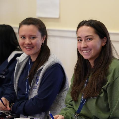 Two students at Lead UNH smiling at camera.