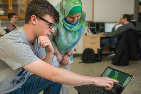 Student and faculty member conducting research