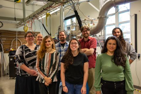 UNH nuclear physics researchers in front of polarized target