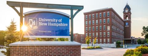 Picture of the front of UNH Manchester building with UNH Manchester sign