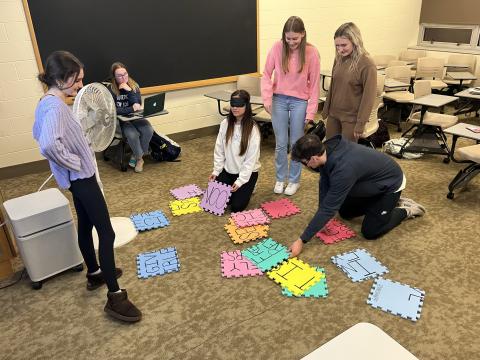 Students participating in SHARPP's consent puzzle teambuilding activity