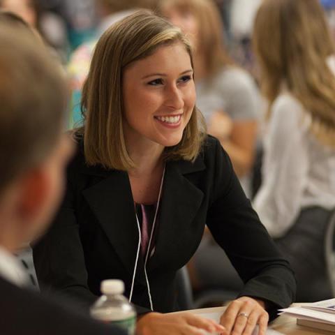 UNH Law student smiling sitting in class