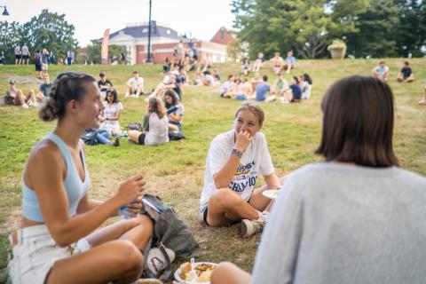 UNH students hanging out on the lawn