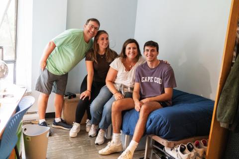 UNH family on move in day in dorm room