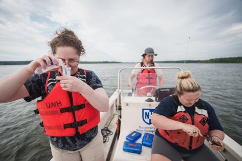 UNH researchers in a boat