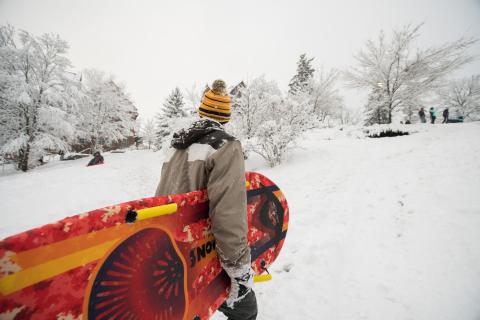 UNH student sledding