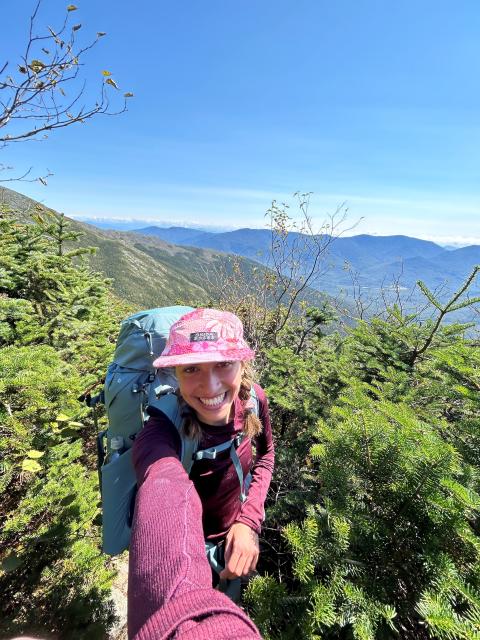 Zara taking a selfie on a mountain