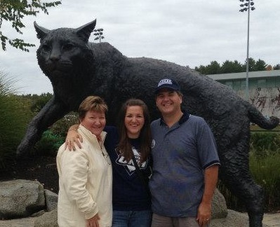 UNH student Callie Ierardi with her parents in front of the Wildcat statue