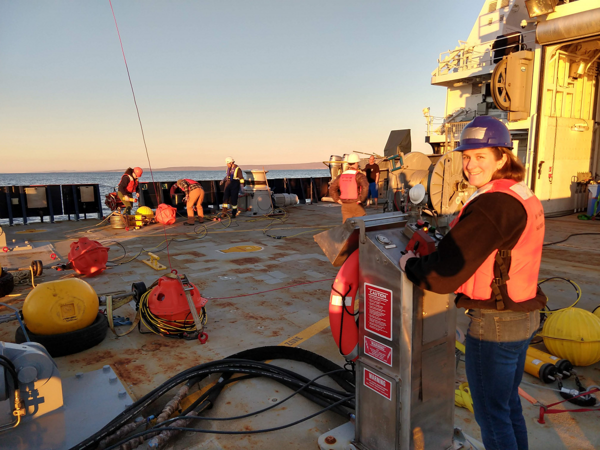 Jennifer Miksis-Olds stands on research vessel