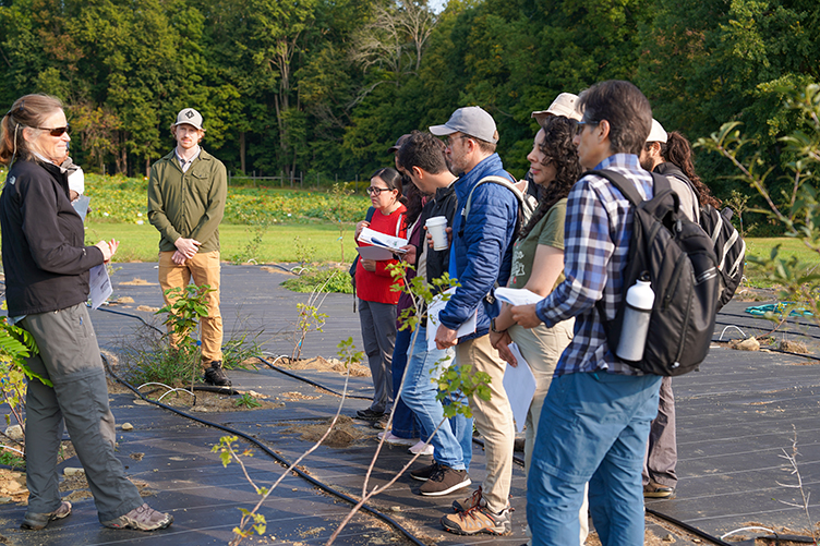 Group of visitors listens to COLSA professor