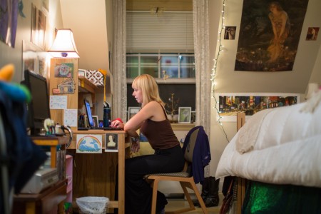 UNH student studying in her dorm room