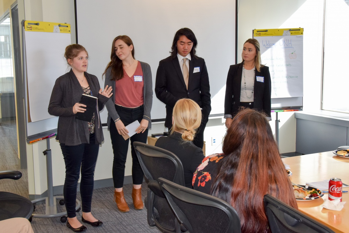 Students present during a visit to Brodeur Partners in Boston.
