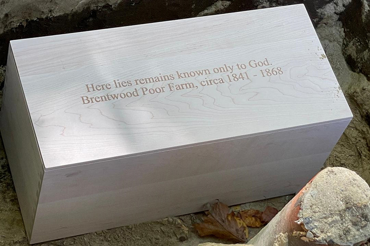 A wooden box with an inscription for remains