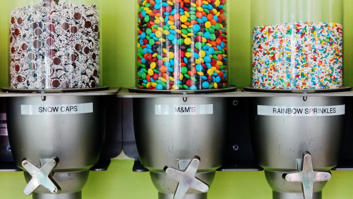 containers of Snow Caps, M&M's and rainbow sprinkles at FroZone in Durham, NH