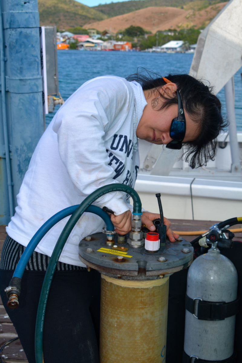 Graduate student on deck of research vessel