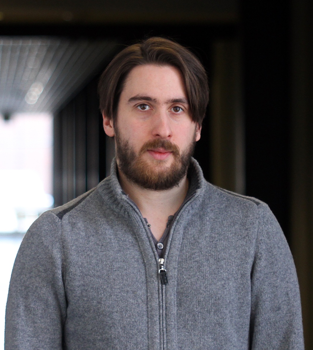 Portrait of male with brown hair wearing a sweater