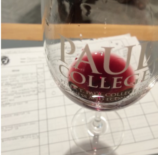 red wine in a UNH Paul College glass