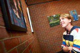 student viewing artwork in philbrook dining hall