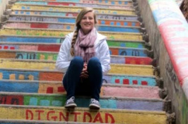sarah wiggins sitting on colorful steps