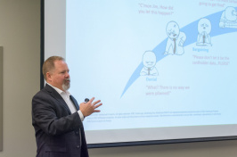 Todd Waskelis, vice president of AT&T Security Solutions, gives a presentation on how to address cyber threats at the Paul College Cybersecurity Symposium.