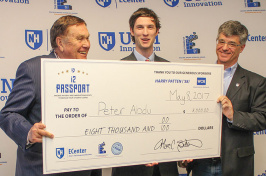 UNH student Peter Abdu ’17 receives a check for $8000
