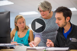 UNH professor Diane Foster with students