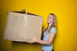 image of woman with moving box, pexels.com