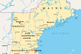 Photo of a map showing the New England states and bordering states and countries.