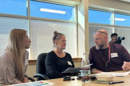 Crisis responders consult with each other during a recent in-person training of the New Hampshire Rapid Response team.