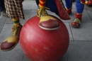 clown feet and a large red ball (Photo: Peter Nicholls / Reuters)