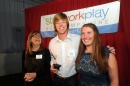 David Hutchings of Windham was presented with the 'Shire Story of the Year Video while flanked by Besty Gardella, left, of New Hampshire Public Radio, and Kate Luczko, president and CEO of Stay Work Play, at the Rising Stars awards sponsored by Stay Work Play New Hampshire hosted at Fieldhouse Sports in Bow on Monday. (Mark Bolton/Union Leader)