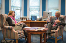 UNH Magazine Editor-in-chief Kristin Waterfield Duisberg talking with President Mark Huddleston