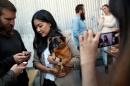 A happy hour event in San Francisco in 2014 for some social media stars. Lindsey Louie with her dog Biggie Griffon. Credit Preston Gannaway for The New York Times