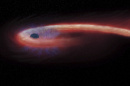 This artist rendering provided by NASA shows a star being swallowed by a black hole, and emitting an X-ray flare, shown in red, in the process