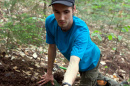 UNH's Ryan Stephens finds a truffle in the Bartlett Experimental Forest. 