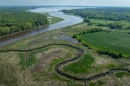 An aerial photo of the Great Bay Estuary in the distance and one of its tributaries in the foreground.