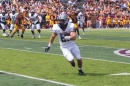 Dylan Laube runs with the ball