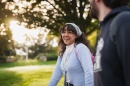 Female student smiling while walking on campus