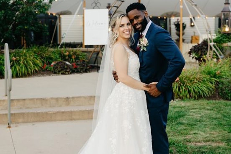 Husband and wife posing together